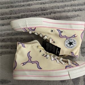 Tyler the Creator/ Converse Cream High-Tops with Pink and Blue Accents.